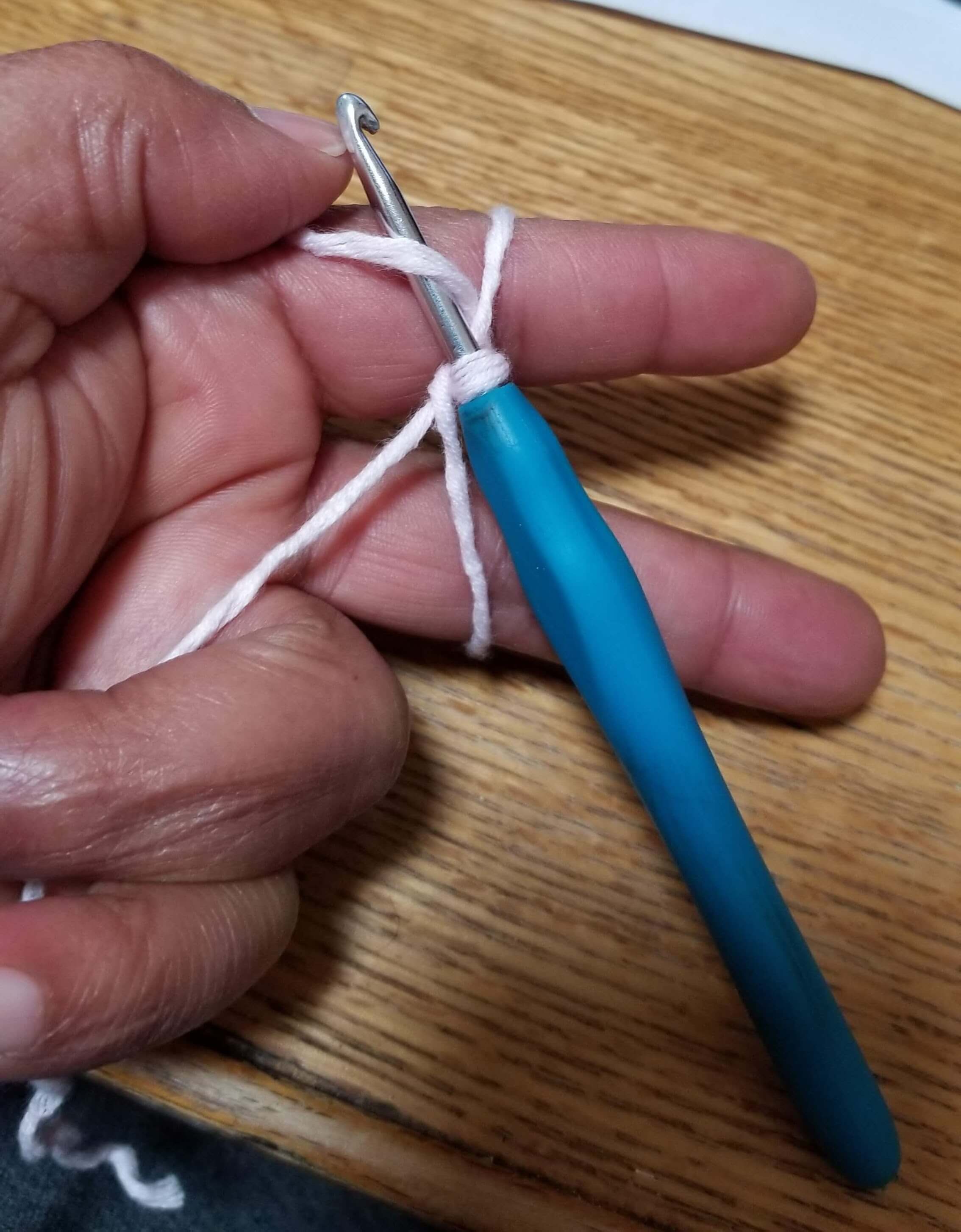 pull top yarn through loop pull top yarn through loop